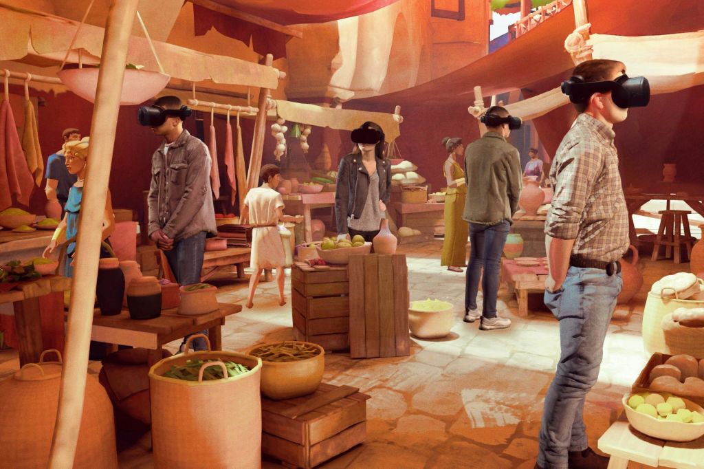 다양한 업체와 상품이 전시된 고대의 시장에서 VR 헤드셋을 착용한 사람들.