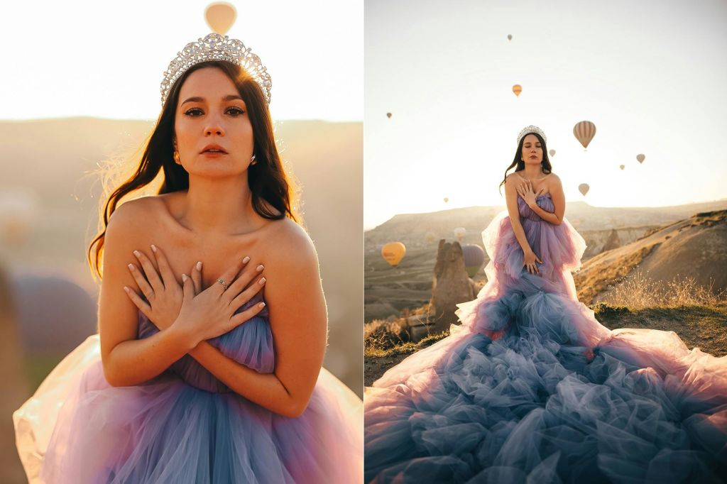 열기구 타고 일출을 배경으로 사진 촬영하기