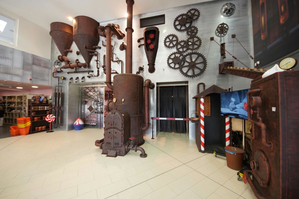 Start your adventure as if you were actually starting a day's work in an old-fashioned chocolate factory!