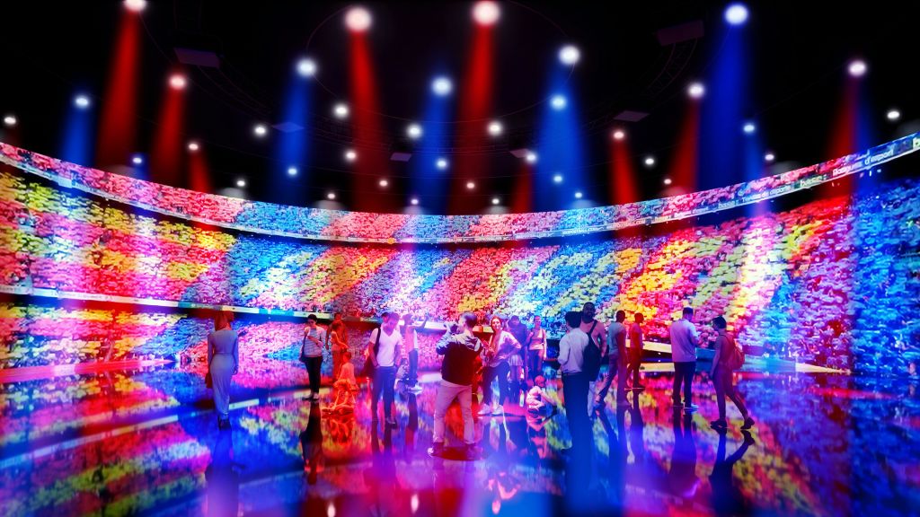 다채로운 색상의 조명과 커다란 곡선형 비디오 월이 다채로운 패턴을 보여주고 있는 활기찬 방에 사람들이 모였습니다.