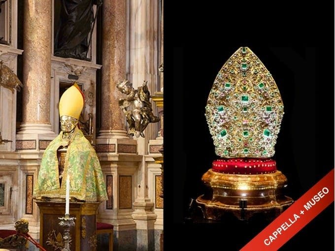 왼쪽에는 주교 복장을 한 동상이, 오른쪽에는 받침대에 보석으로 장식된 주교관이 있는 화려한 교회 내부.