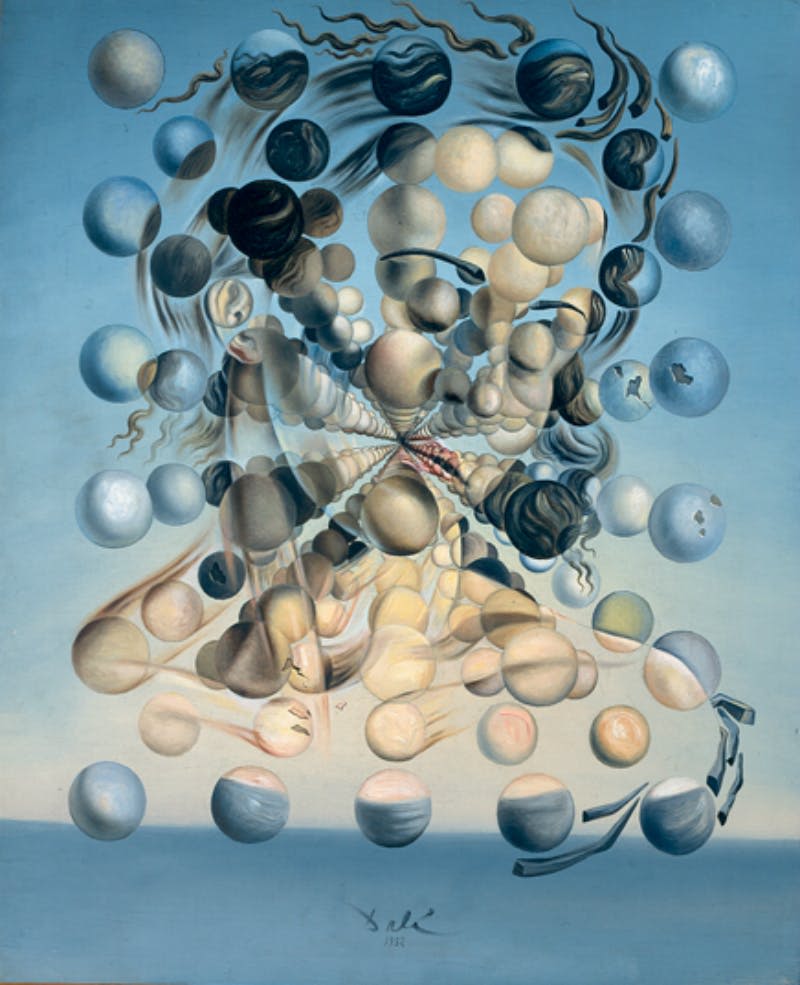 다색 구의 배열은 파란색 배경에 대해 왜곡되고 추상적인 얼굴을 형성합니다.