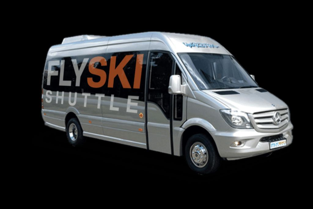 검은색 배경에 'FlySki Shuttle' 이라는 글자가 굵은 글씨로 표시된 실버 셔틀 버스.