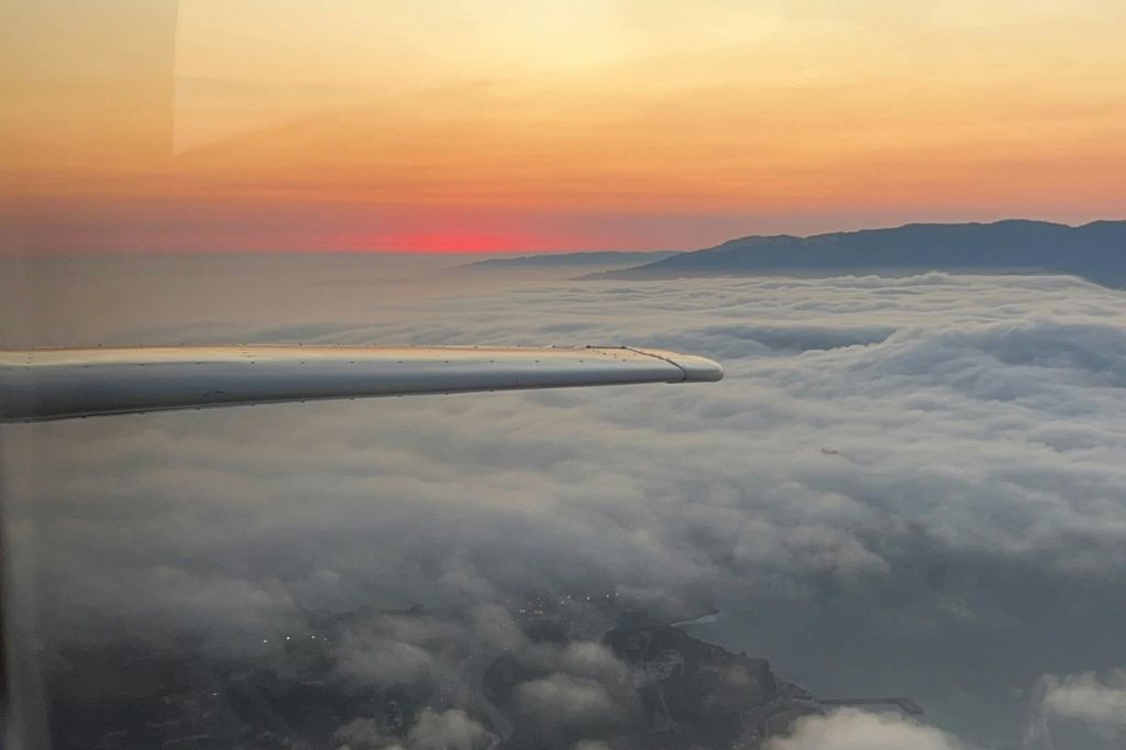 Sunset over the clouds