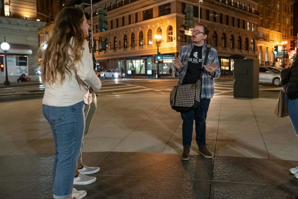 A tour guide sharing tales with guests