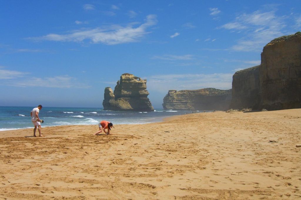 Walk the beach and see the Apostles from the water's edge