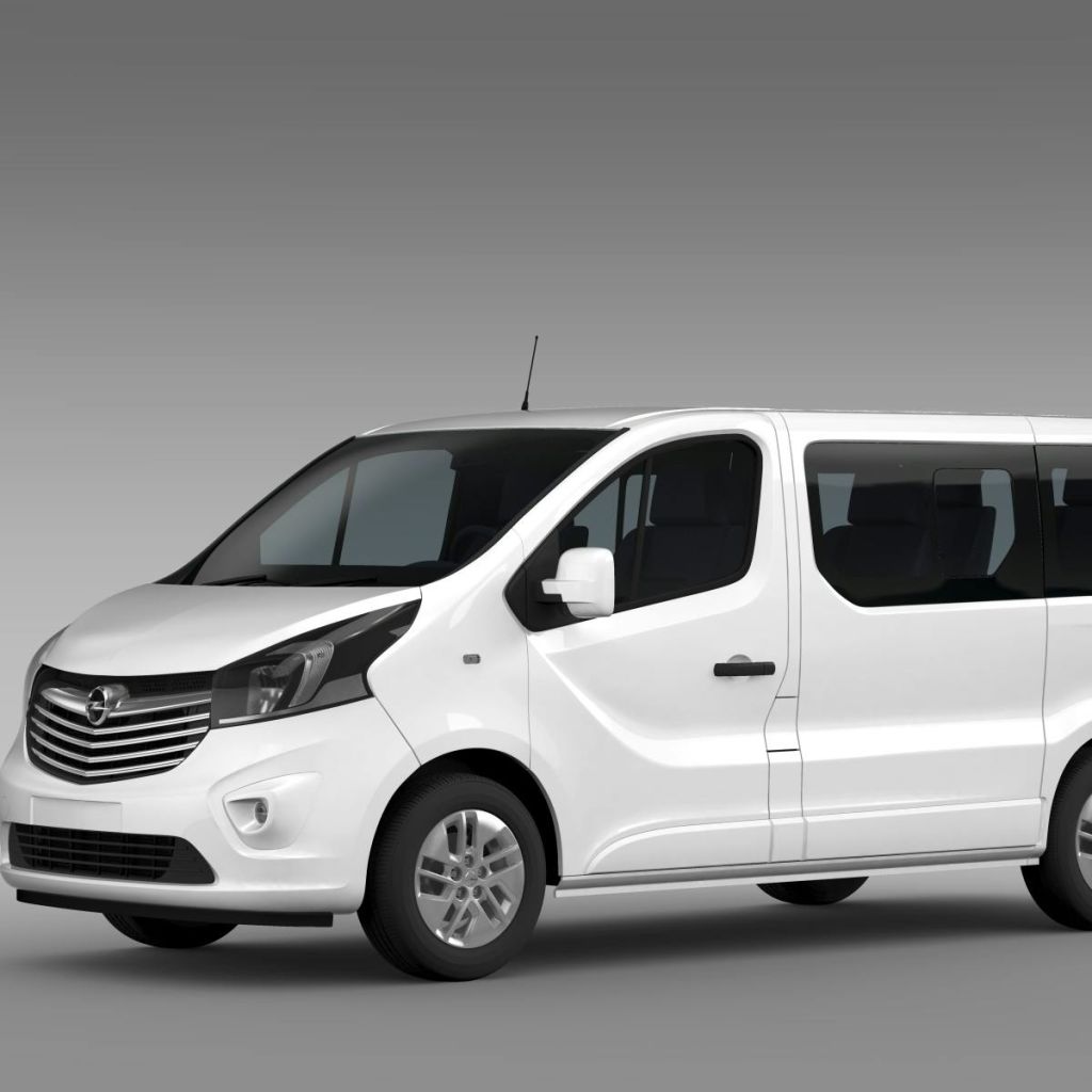 착색된 창문과 세련된 디자인의 흰색 승합차가 회색 배경에 주차되어 있습니다.