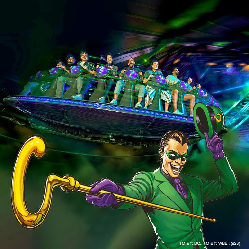 빙글빙글 도는 놀이공원을 달리는 사람들. 앞면에는 녹색 양복을 입은 만화 캐릭터가 금색 지팡이와 모자를 들고 있습니다.