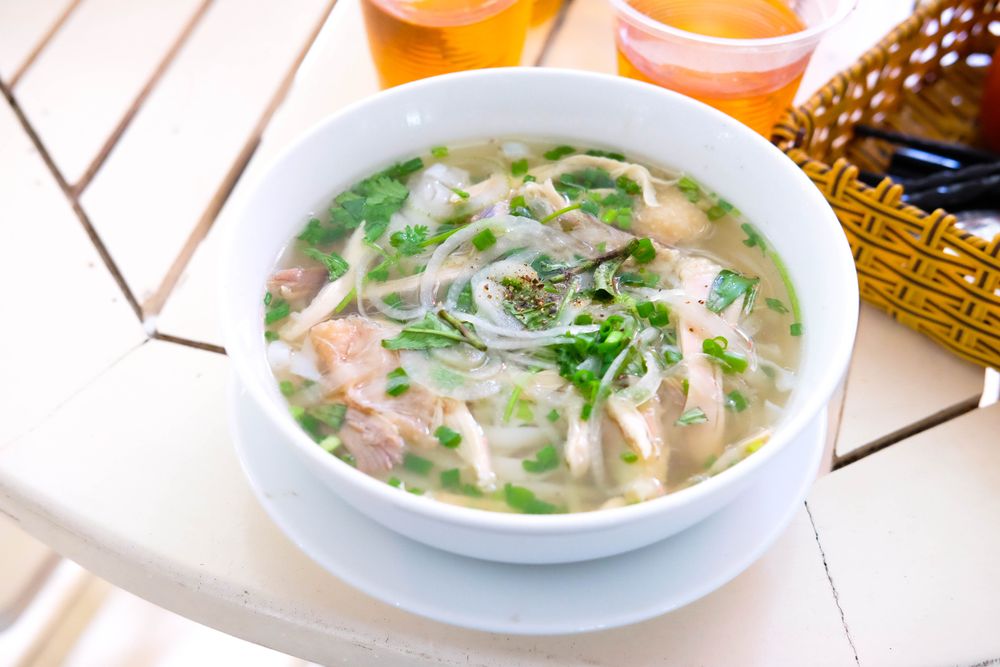 Half chicken rice noodle soup